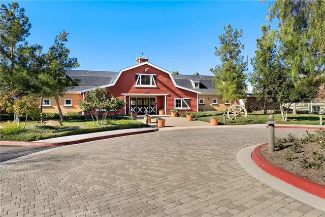 a sign board with buildings in the background