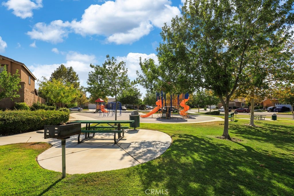 264 CLEOMELLA Court Hemet, CA 92543 - Photo 30 of 31 a view of a park with swings and slides