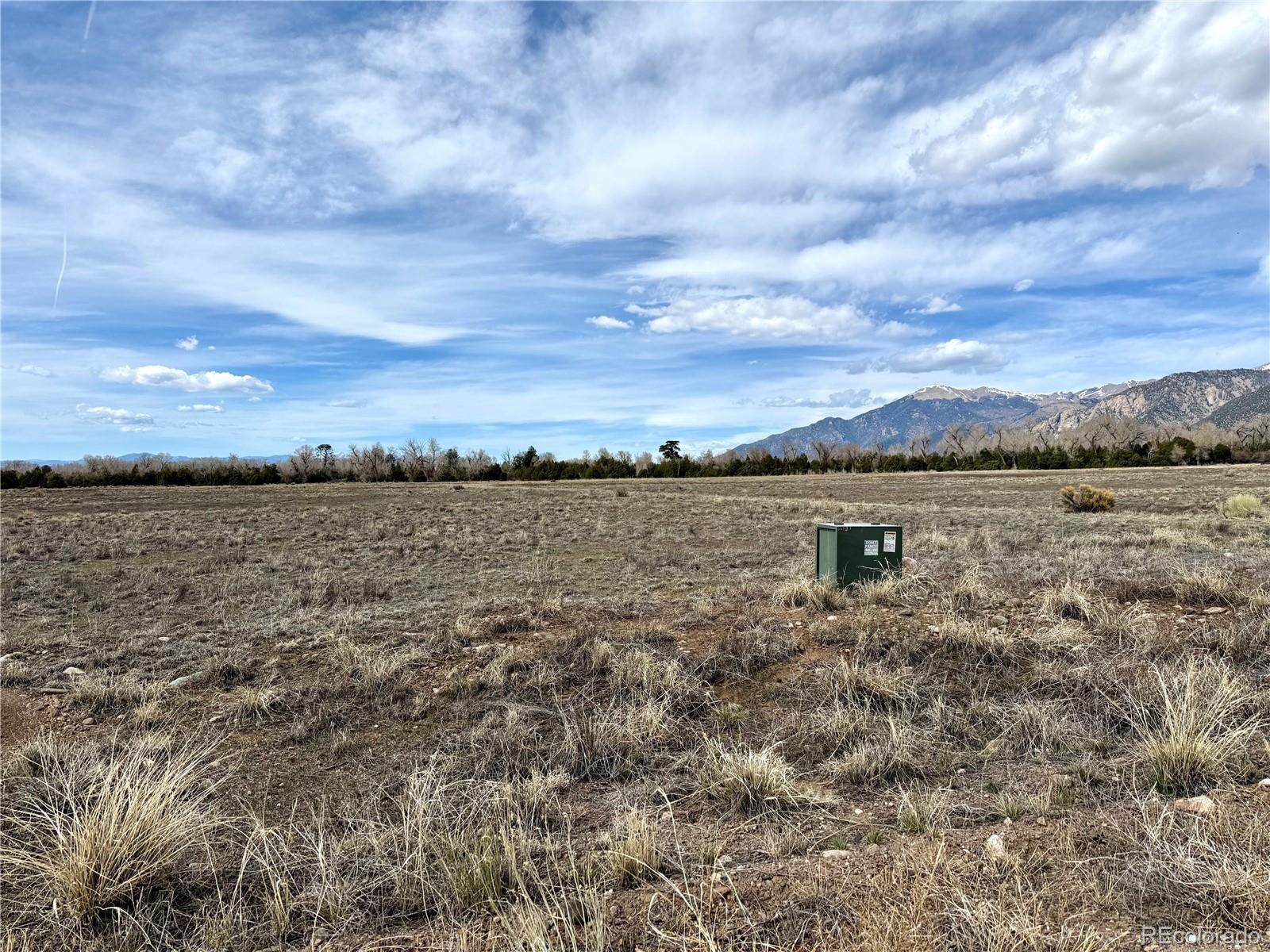 915 Brook Trout Road Crestone, CO 81131 - Photo 2 of 6 a view of a lake from a yard