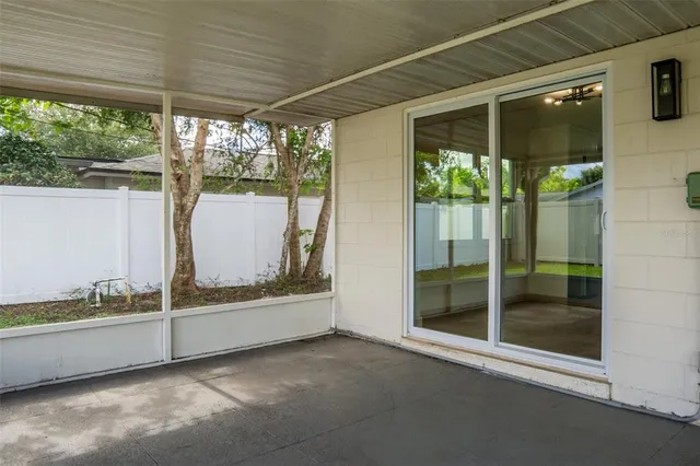 a view of a glass door and garden