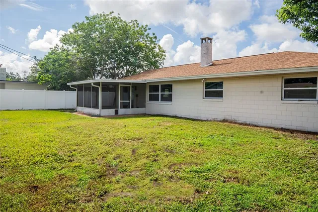 a house view with swimming pool