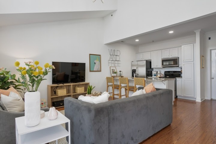 2010 Birch Lane Spring Hill, TN 37174 - Photo 1 of 47 a living room with furniture a flat screen tv and a refrigerator