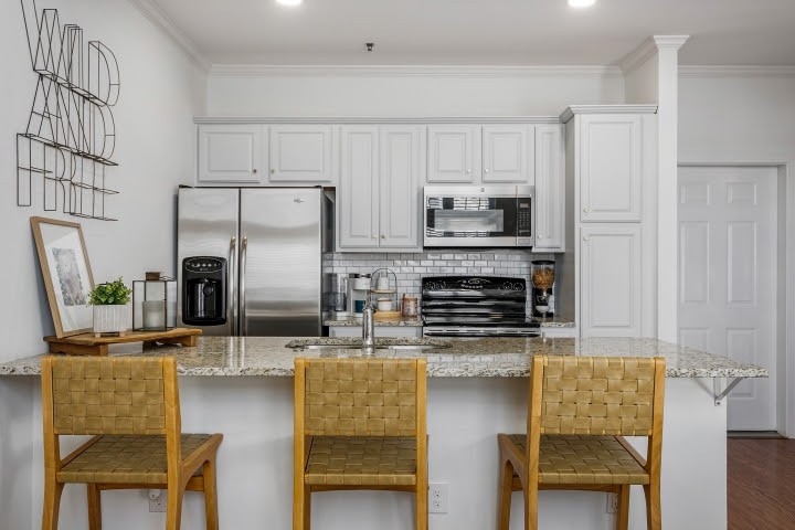 2010 Birch Lane Spring Hill, TN 37174 - Photo 7 of 47 a kitchen with kitchen island a counter top space cabinets and stainless steel appliances