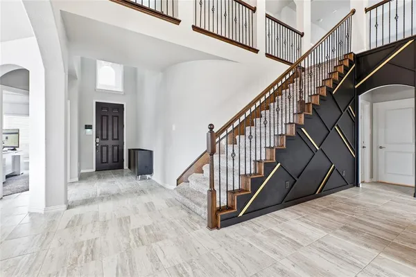 a view of an entryway with wooden floor