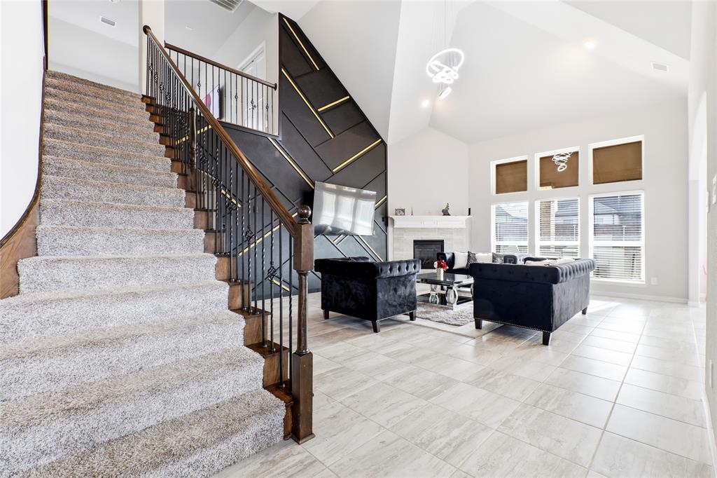1315 Cascade Lane Forney, TX 75126 - Photo 15 of 36 a living room with fireplace furniture and a window
