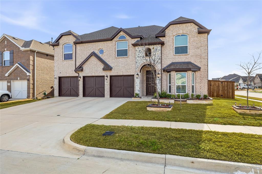 1315 Cascade Lane Forney, TX 75126 - Photo 17 of 36 a front view of a house with garden