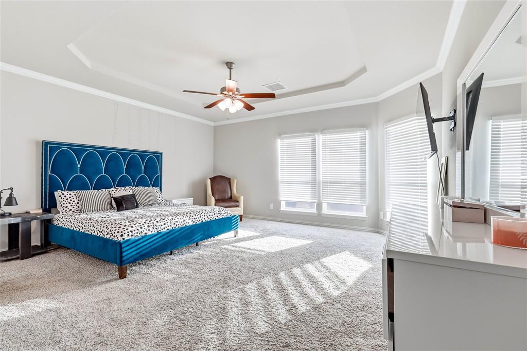 1315 Cascade Lane Forney, TX 75126 - Photo 20 of 36 a bedroom with a bed a window and a couch