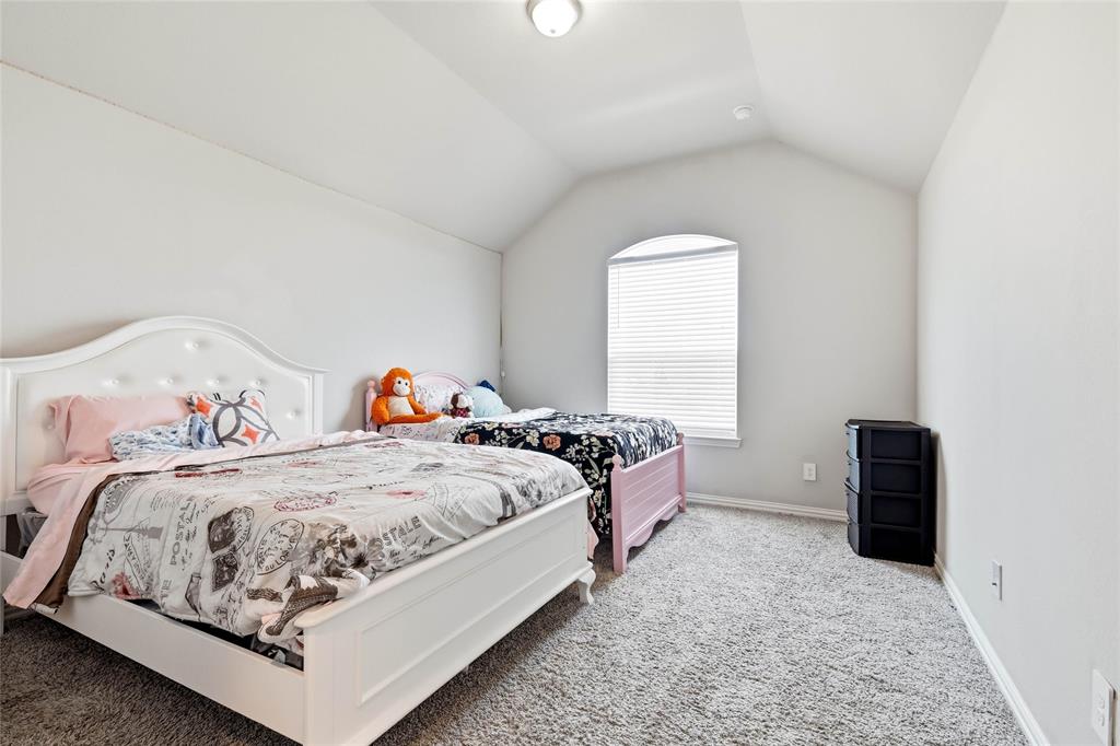 1315 Cascade Lane Forney, TX 75126 - Photo 21 of 36 a bedroom with a bed and window