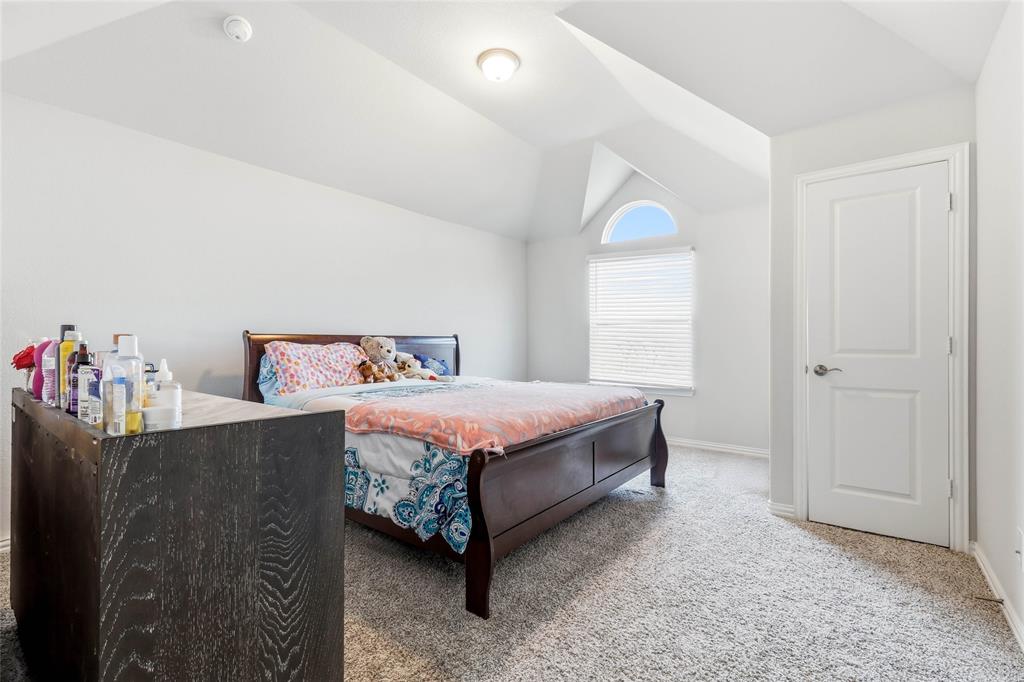 1315 Cascade Lane Forney, TX 75126 - Photo 24 of 36 a bedroom with a bed and a window