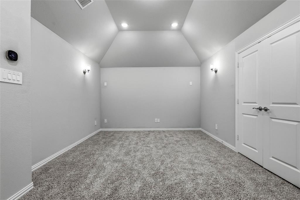 1315 Cascade Lane Forney, TX 75126 - Photo 32 of 36 an empty room with a workbench