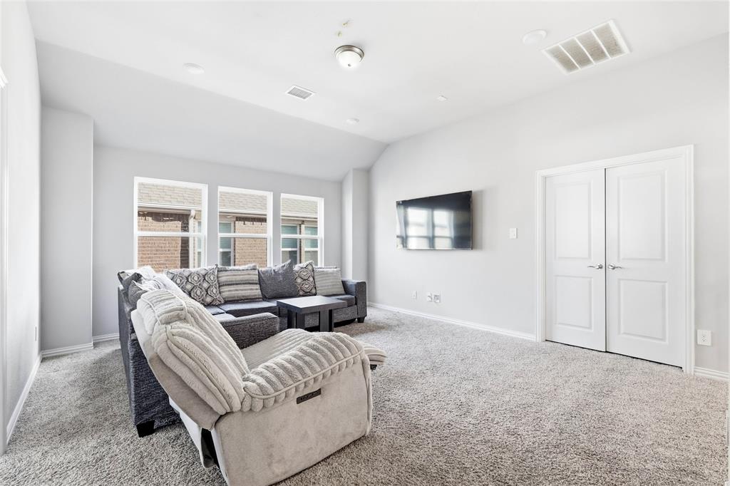 1315 Cascade Lane Forney, TX 75126 - Photo 10 of 36 a living room with furniture and a window