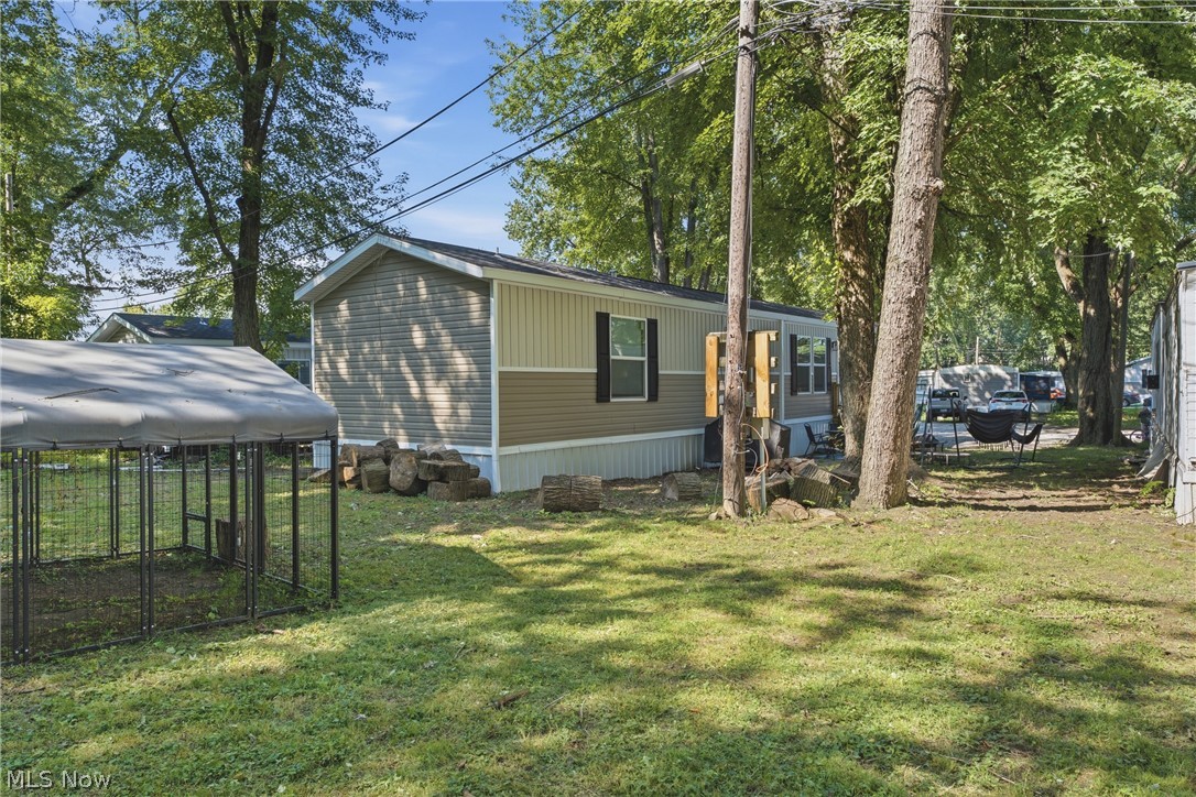 4516 Navarre Road Southwest, Unit 13 Canton, OH 44706 - Photo 27 of 30 Spacious grassy area surrounded by mature trees