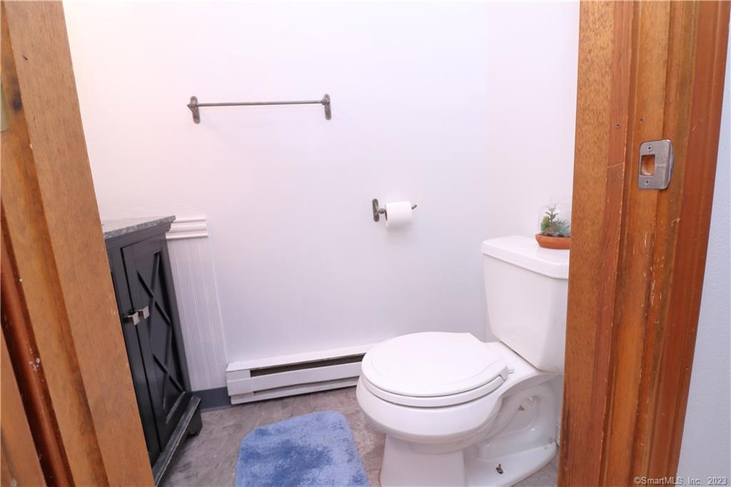 482 Lake Avenue, Unit 4 Bristol, CT 06010 - Photo 8 of 12 a white toilet sitting next to a shower