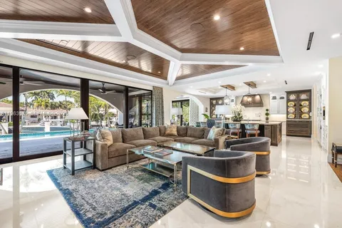 a view of a a dining room with furniture window and wooden floor