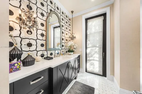 a bathroom with a granite countertop sink a mirror and a shower
