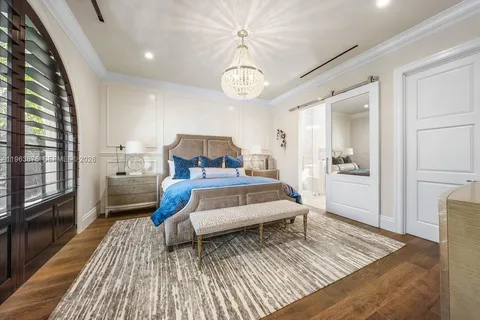 a living room with fireplace furniture and a large window