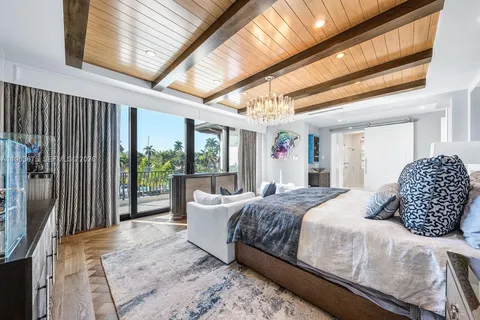 a bathroom with a granite countertop sink a mirror and a bathtub