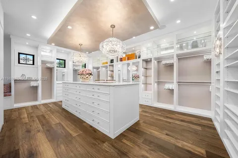 a bathroom with a shower sink vanity granite and a mirror