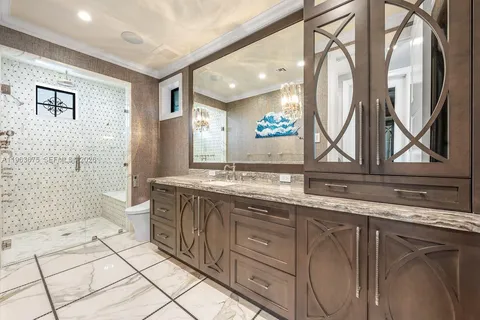 a bathroom with a granite countertop sink a toilet and a bathtub
