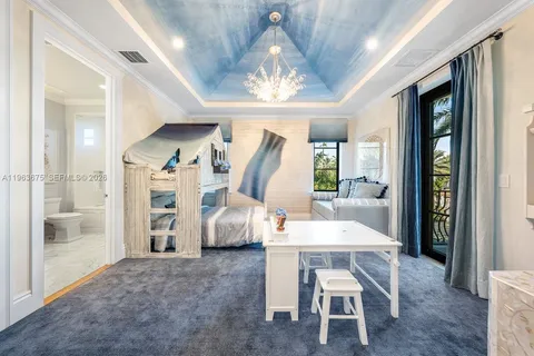 a kitchen with cabinets and wooden floor