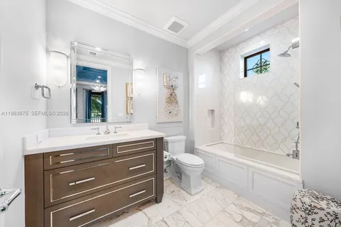 a utility room with cabinets washer and dryer