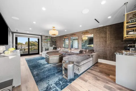a view of a patio with swimming pool and sitting area