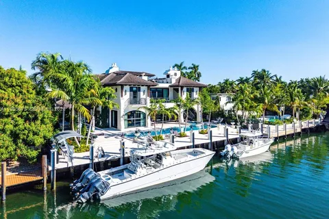 a view of swimming pool with outdoor seating and plants