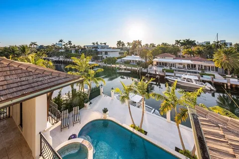 a group of cars parked in front of a house