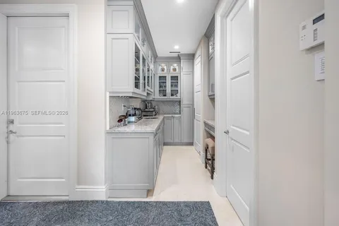 a view of a swimming pool with a lounge chair and palm trees