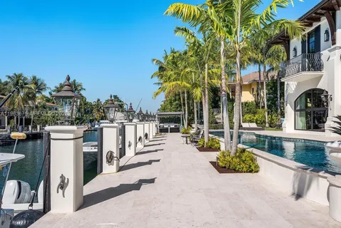 an aerial view of a house with yard swimming pool and outdoor seating