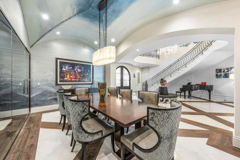 a living room with lots of furniture and a large window