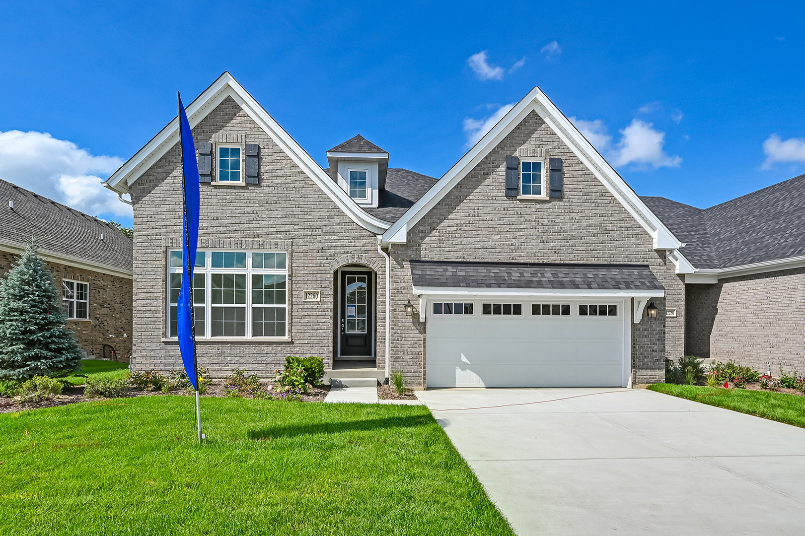 12260 Copper Ridge Drive, Unit 39 Lemont, IL 60439 - Photo 1 of 24 a front view of a house with a yard and garage