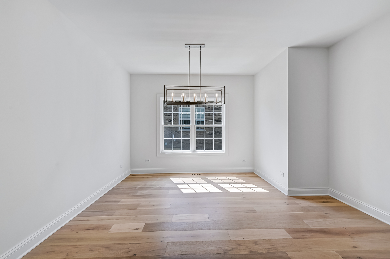 12260 Copper Ridge Drive, Unit 39 Lemont, IL 60439 - Photo 15 of 24 a view of an empty room with windows