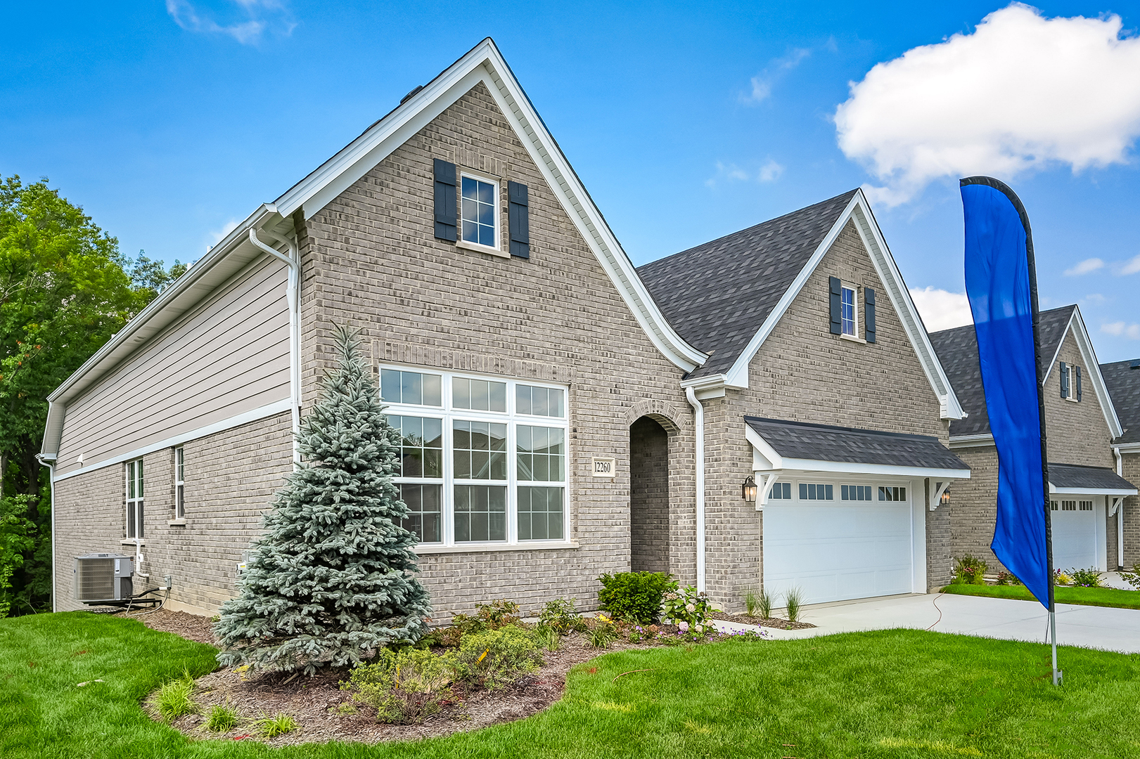 12260 Copper Ridge Drive, Unit 39 Lemont, IL 60439 - Photo 3 of 24 a front view of a house with a yard and garage
