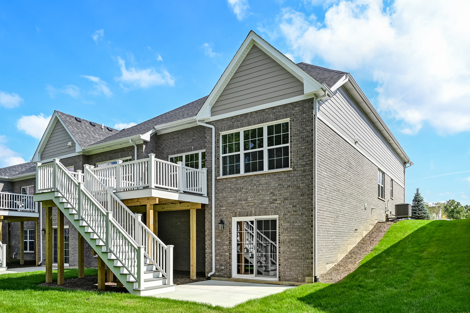12260 Copper Ridge Drive, Unit 39 Lemont, IL 60439 - Photo 4 of 24 a front view of a house with a yard