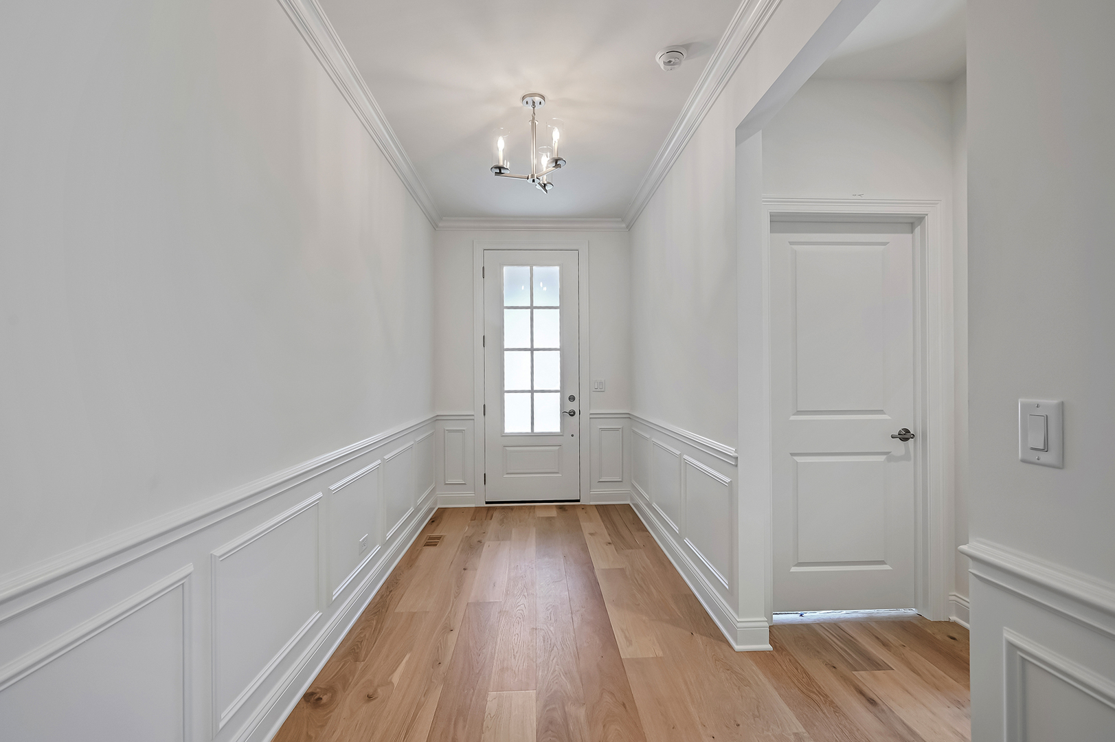 12260 Copper Ridge Drive, Unit 39 Lemont, IL 60439 - Photo 6 of 24 wooden floor in an empty room with a window
