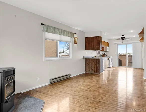 a view of a livingroom with wooden floor and cabinet