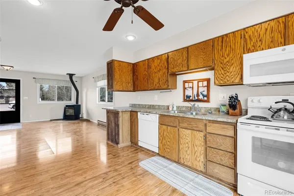 a view of a living room with wooden floor