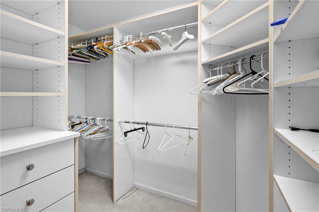 23081 Rosedale Drive, Unit 101 Estero, FL 34135 - Photo 18 of 38 a view of storage and utility room with racks on the wall