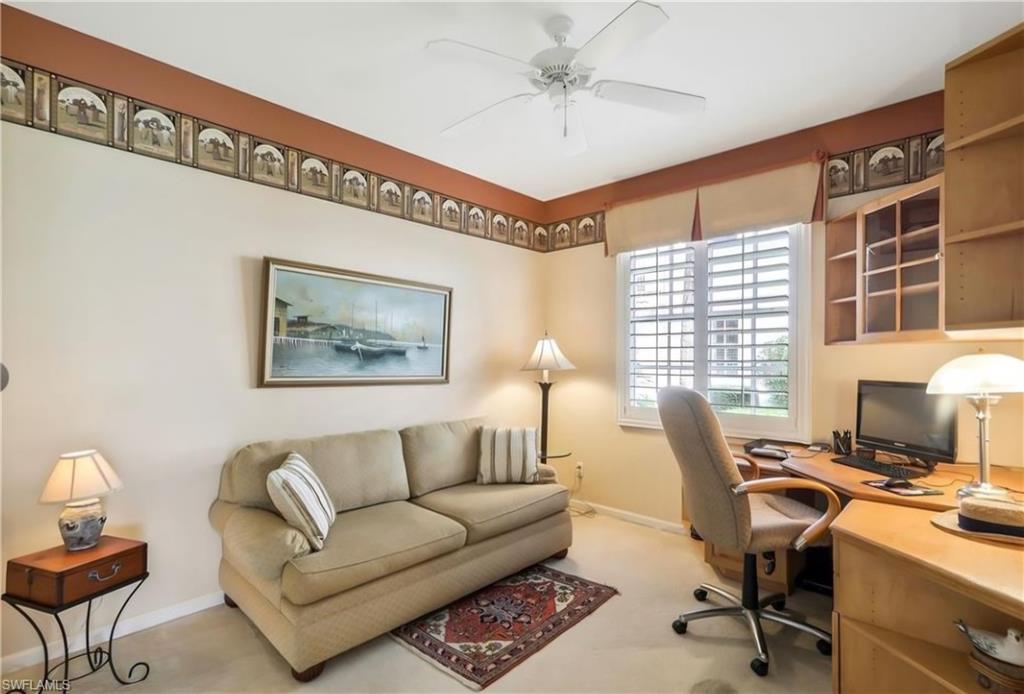23081 Rosedale Drive, Unit 101 Estero, FL 34135 - Photo 22 of 38 a view of a livingroom with workspace and a window
