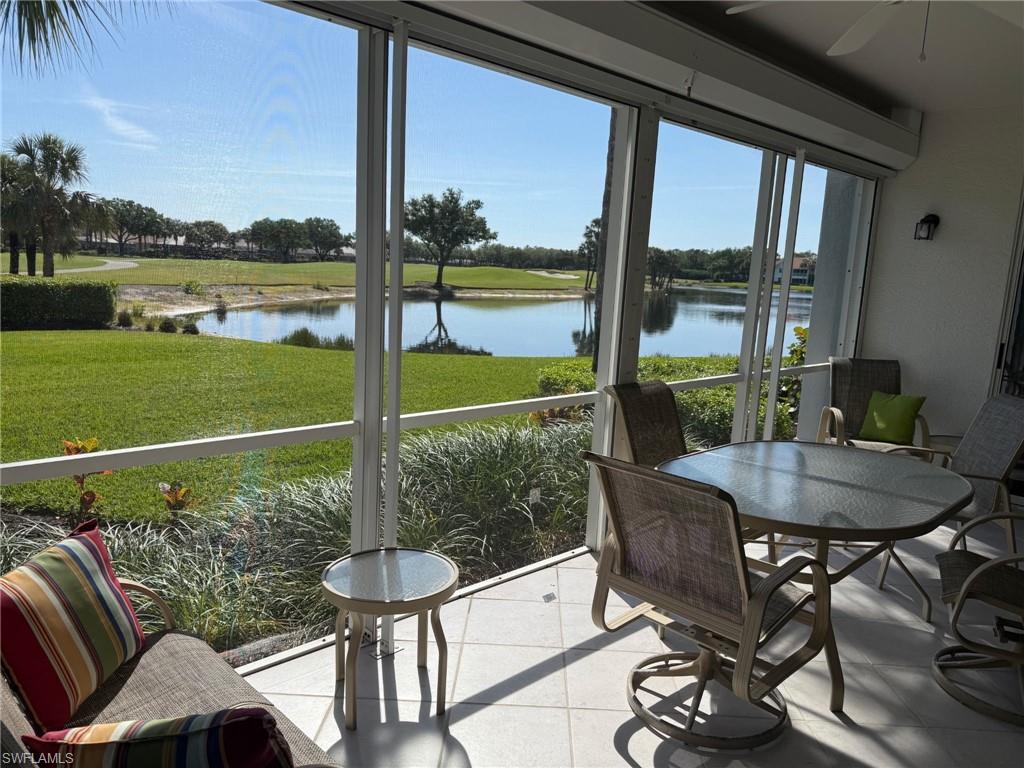 23081 Rosedale Drive, Unit 101 Estero, FL 34135 - Photo 3 of 38 a view of a porch with furniture and a yard