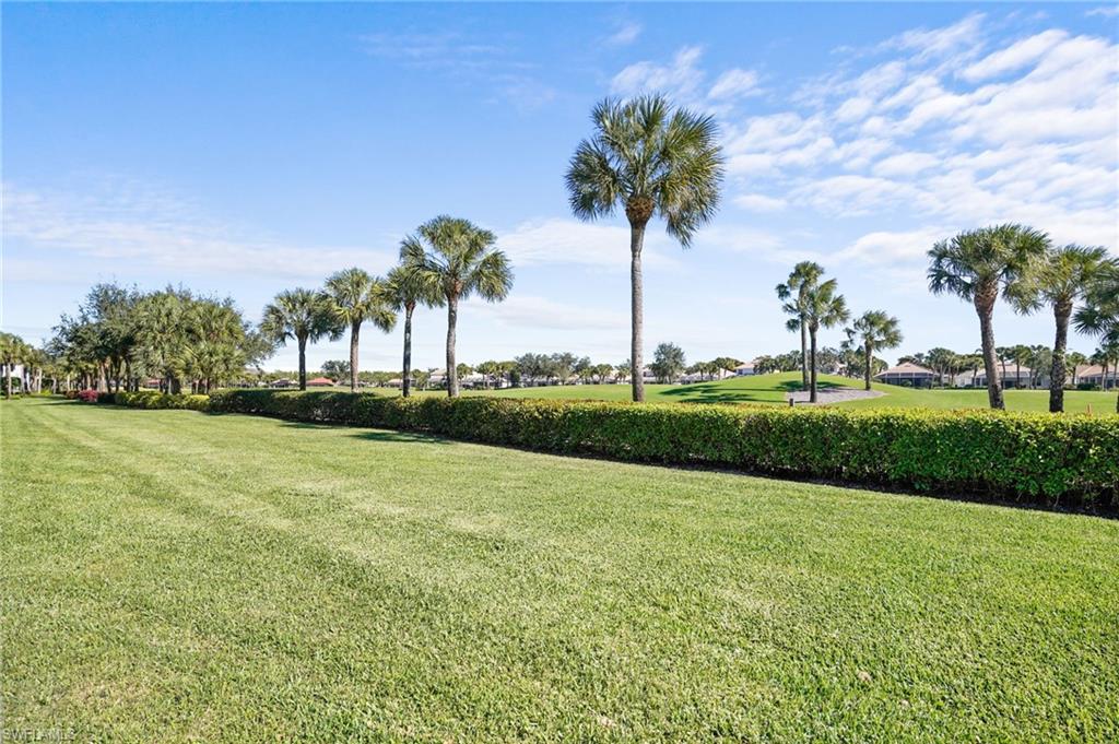 23081 Rosedale Drive, Unit 101 Estero, FL 34135 - Photo 37 of 41 View of property's community featuring a lawn and golf course view