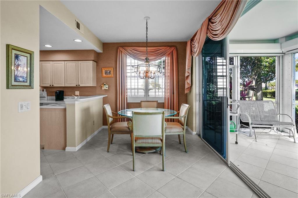 23081 Rosedale Drive, Unit 101 Estero, FL 34135 - Photo 7 of 38 a dining room with furniture and window