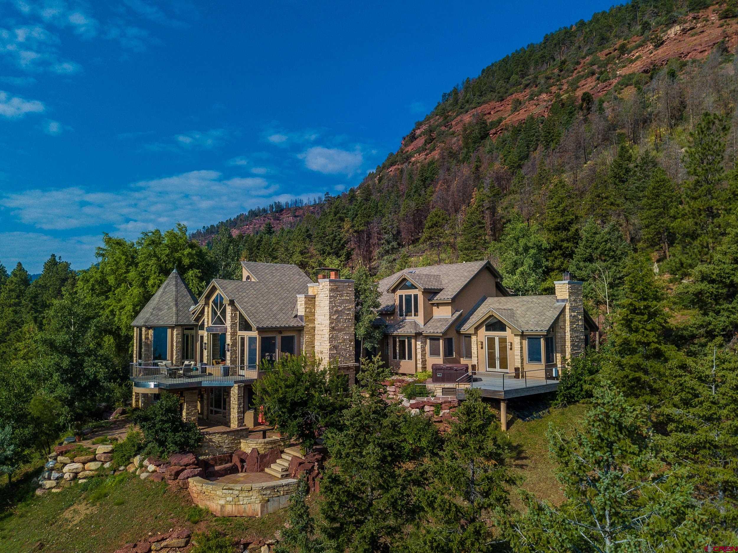 9475 High Meadows Durango, CO 81301 - Photo 2 of 35 a aerial view of a house with swimming pool next to a yard