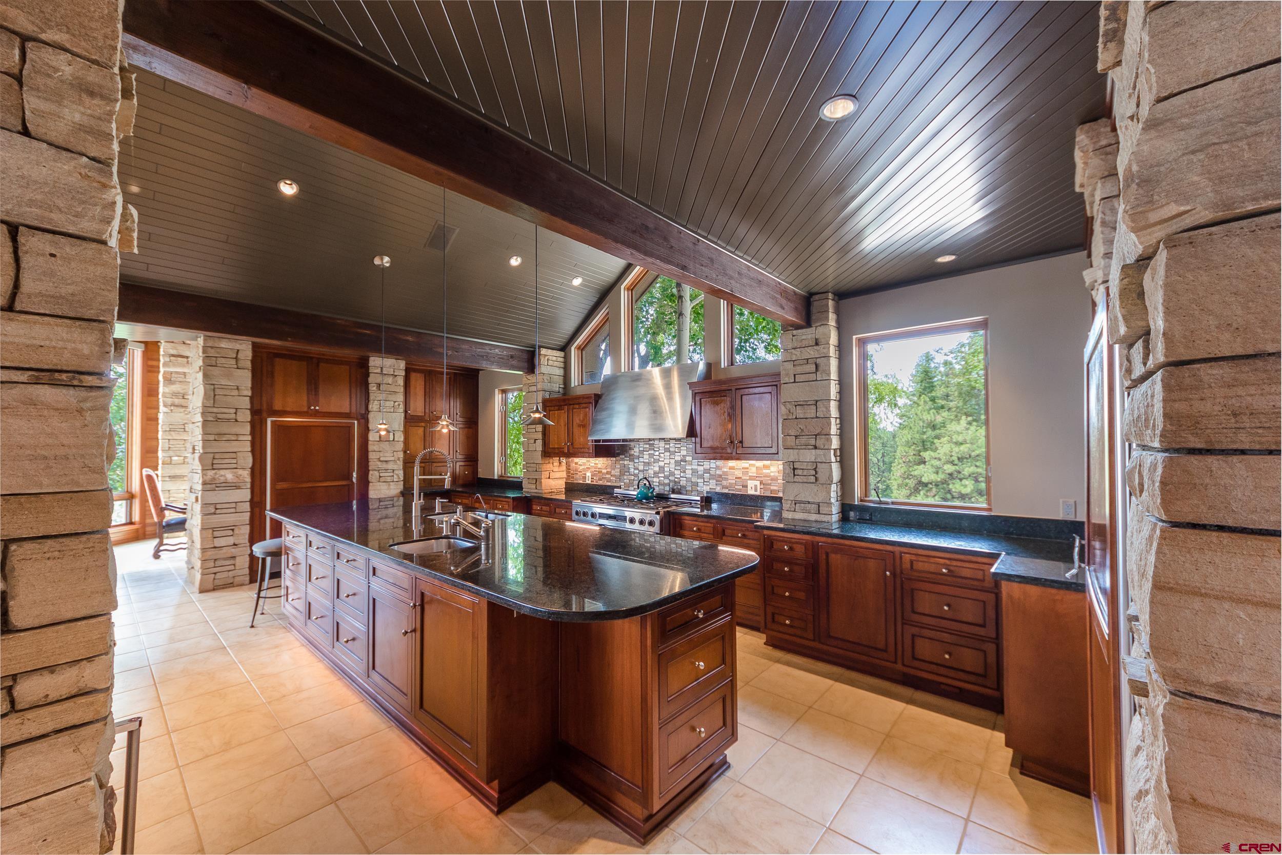 9475 High Meadows Durango, CO 81301 - Photo 11 of 35 a kitchen with sink a counter top space and stainless steel appliances