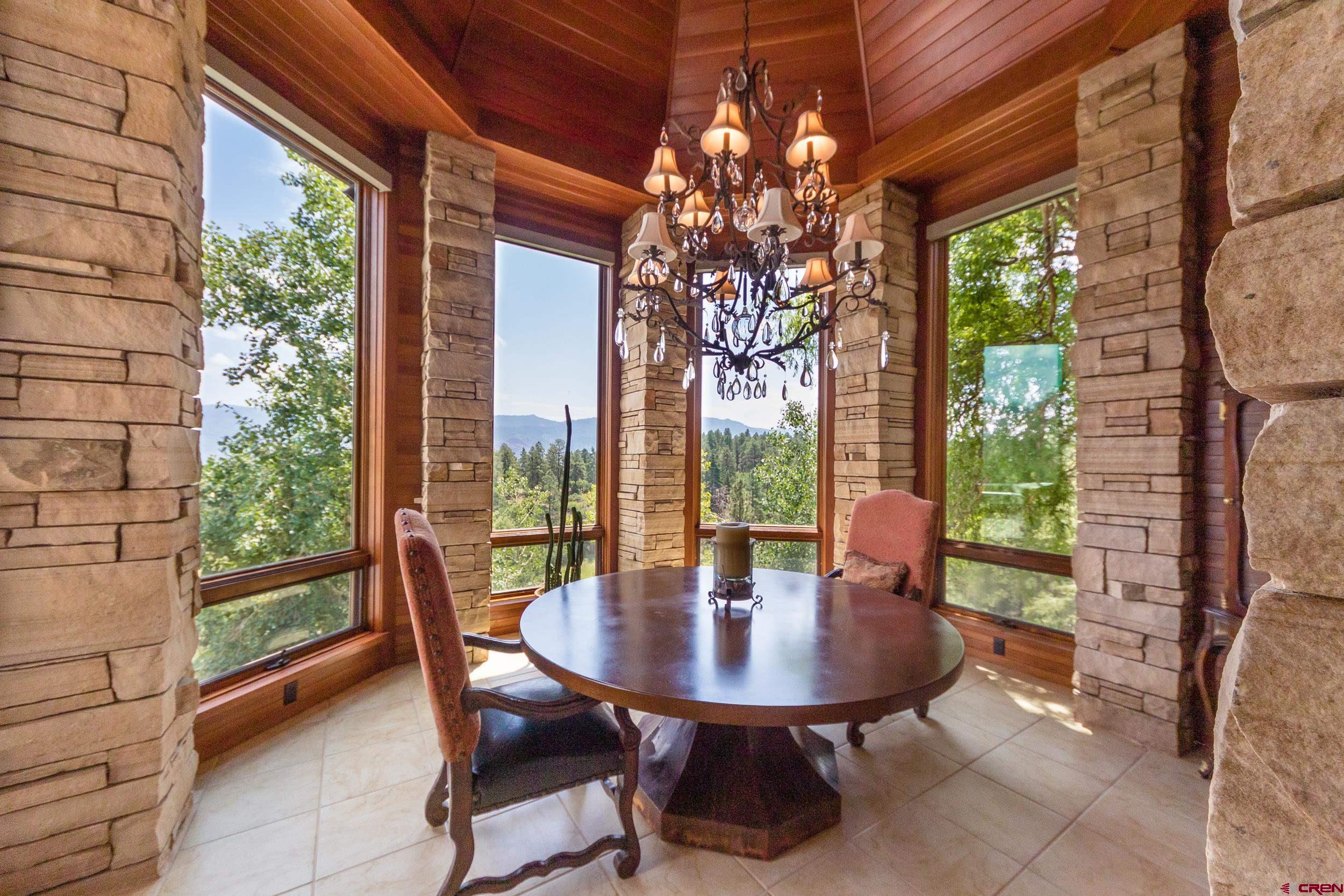 9475 High Meadows Durango, CO 81301 - Photo 12 of 35 a view of a dining room with furniture window and outside view