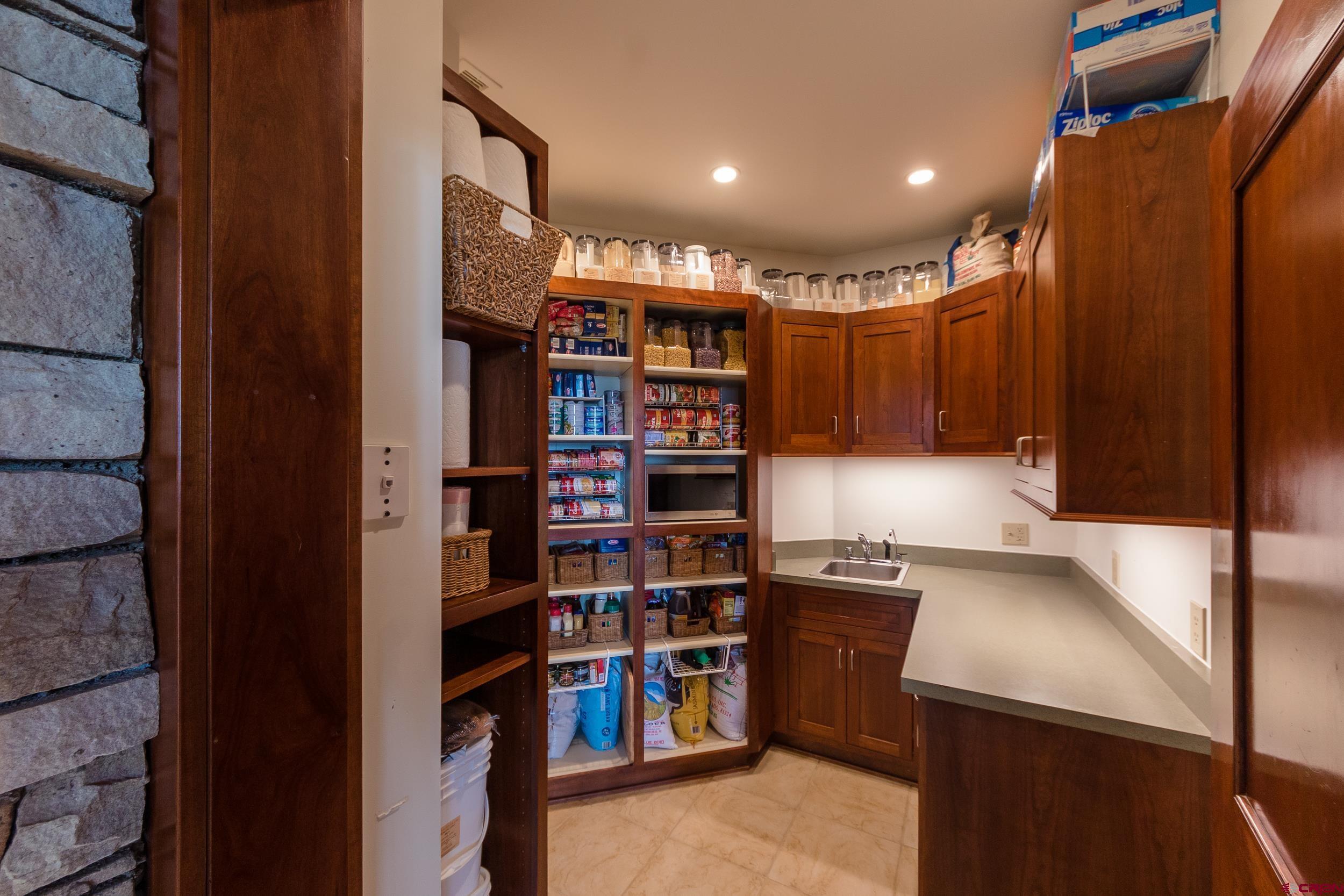 9475 High Meadows Durango, CO 81301 - Photo 13 of 35 a view of walk in closet with clothes and shoes