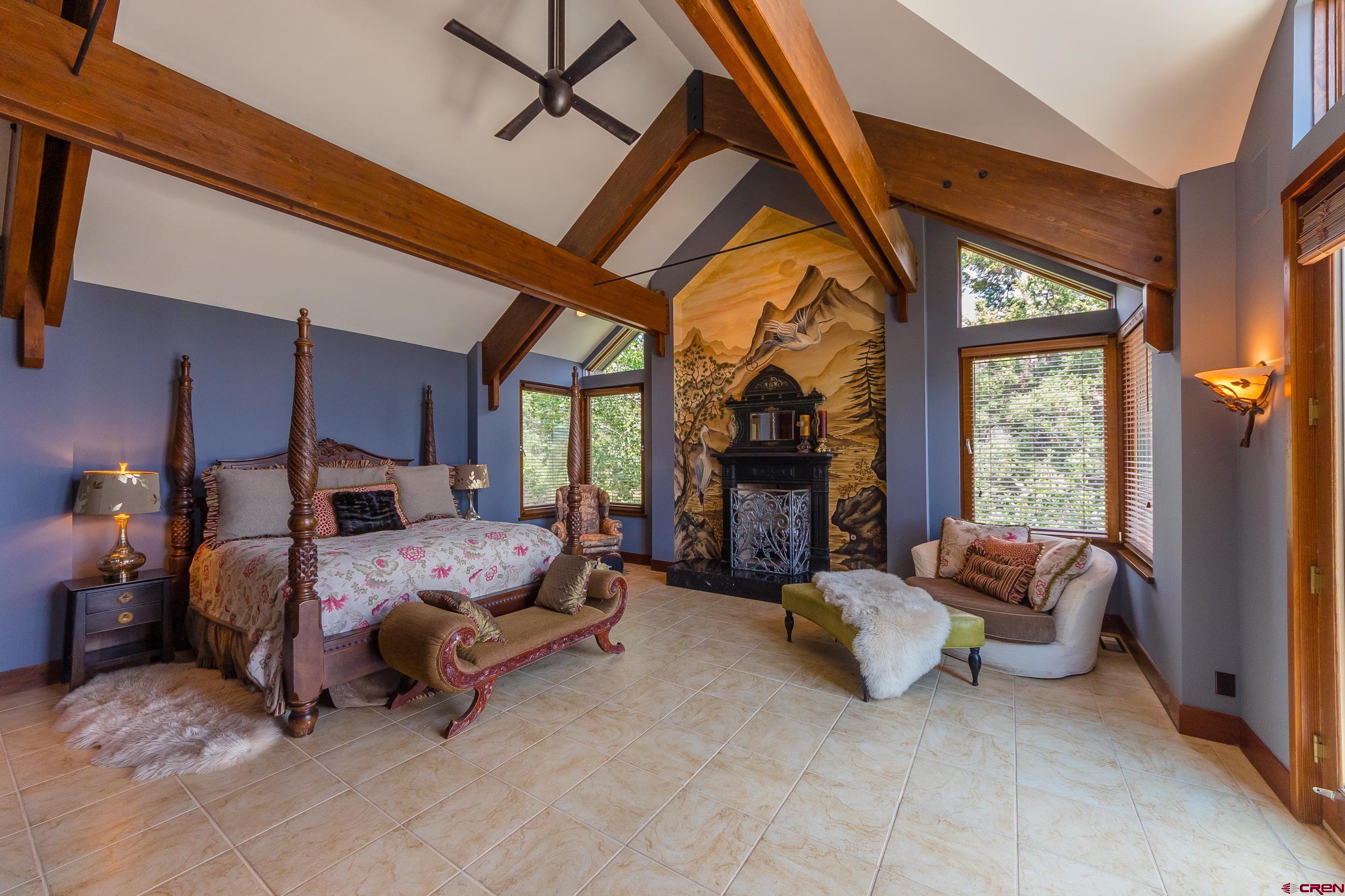 9475 High Meadows Durango, CO 81301 - Photo 14 of 35 a bed room with a bed and a chair
