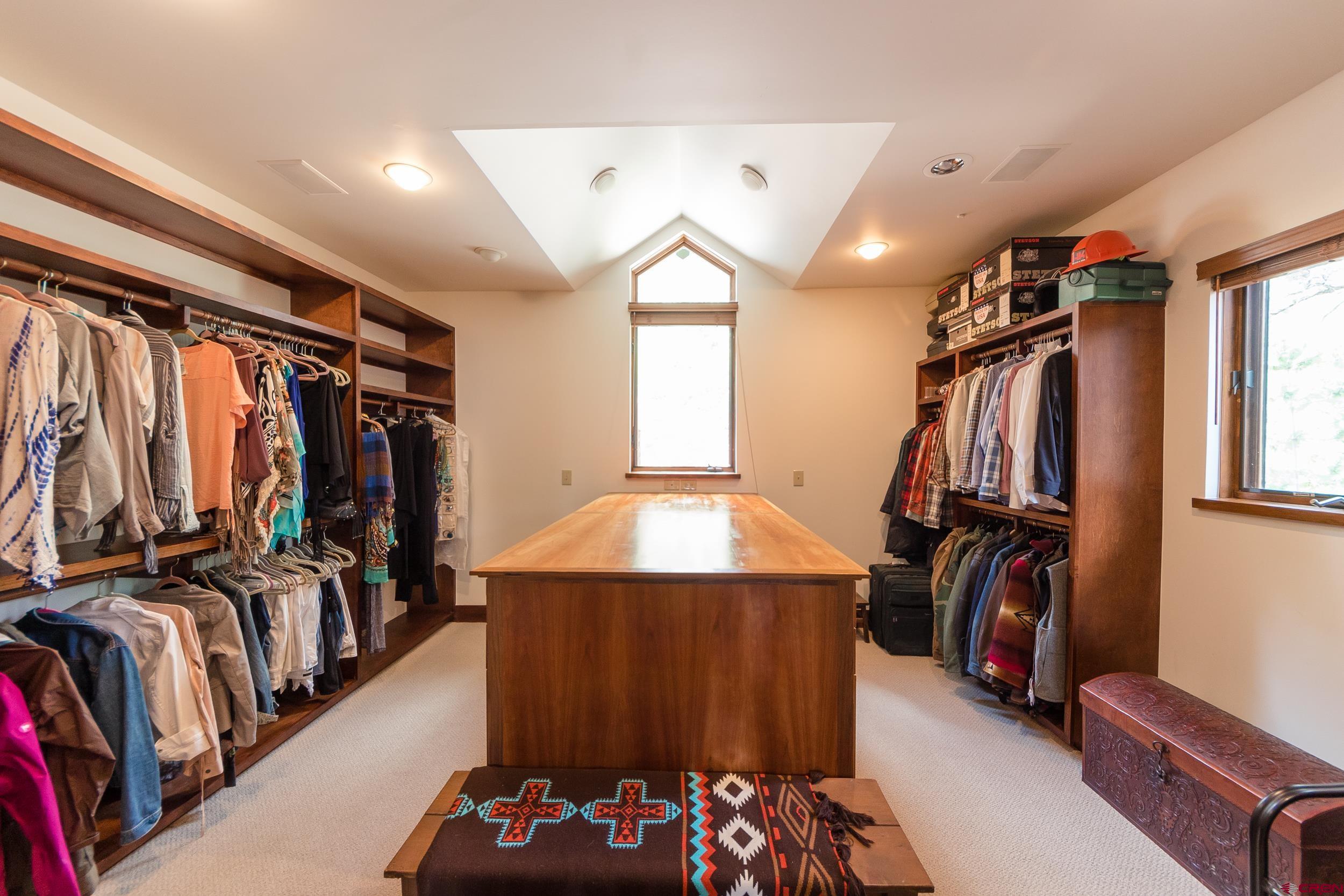 9475 High Meadows Durango, CO 81301 - Photo 15 of 35 a view of walk in closet with clothes and shoes