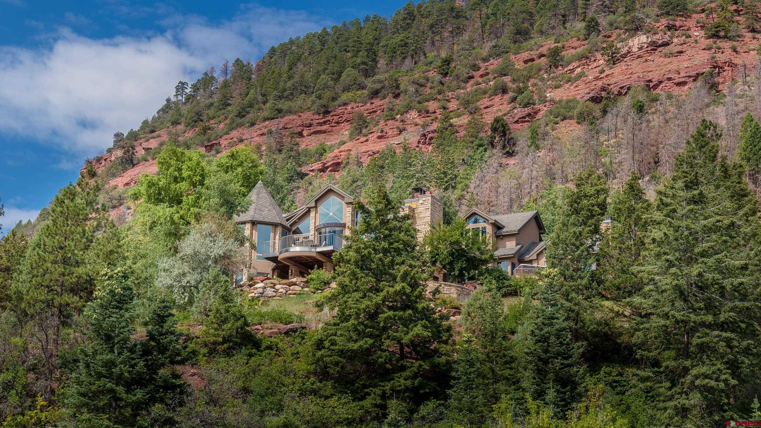 9475 High Meadows Durango, CO 81301 - Photo 3 of 35 an aerial view of a house with a yard